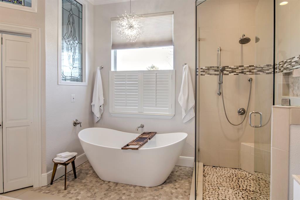 4275 Old Thomas Road Aubrey, TX 76227 - Photo 18 of 31 Double Slipper tub featuring a stunning chandelier light fixture, with walk in shower.