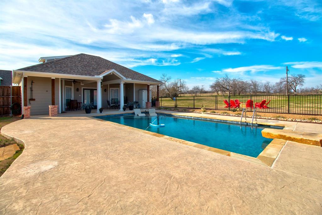 4275 Old Thomas Road Aubrey, TX 76227 - Photo 29 of 32 Pool House features 1 bedroom 1 bathroom apartment with laundry and a full kitchen. Separate outdoor shower for pool guests!