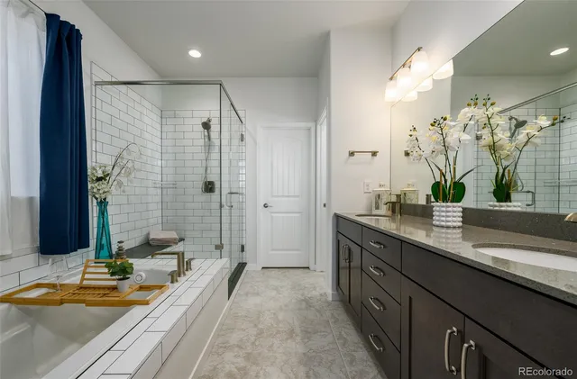 a spacious bathroom with a granite countertop sink and a mirror