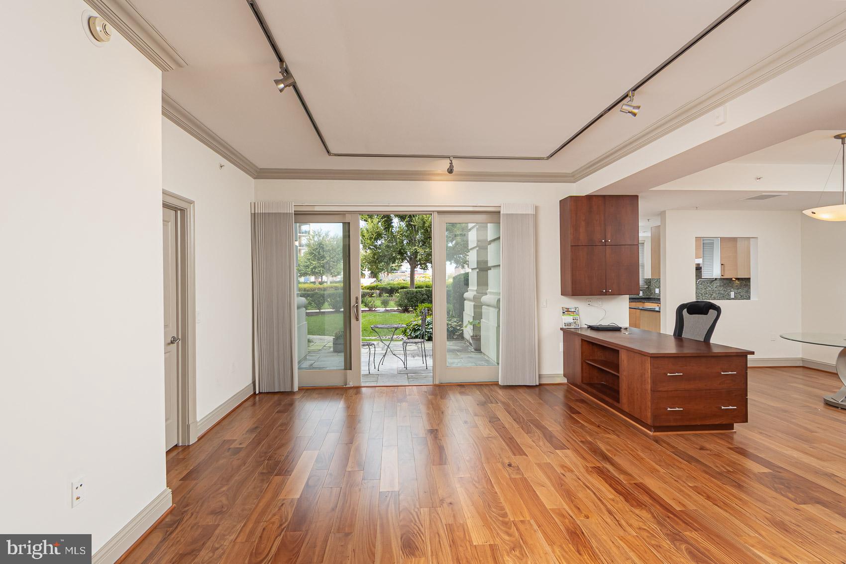 801 Key Highway, Unit 153 Baltimore, MD 21230 - Photo 11 of 40 a living room with furniture and large windows