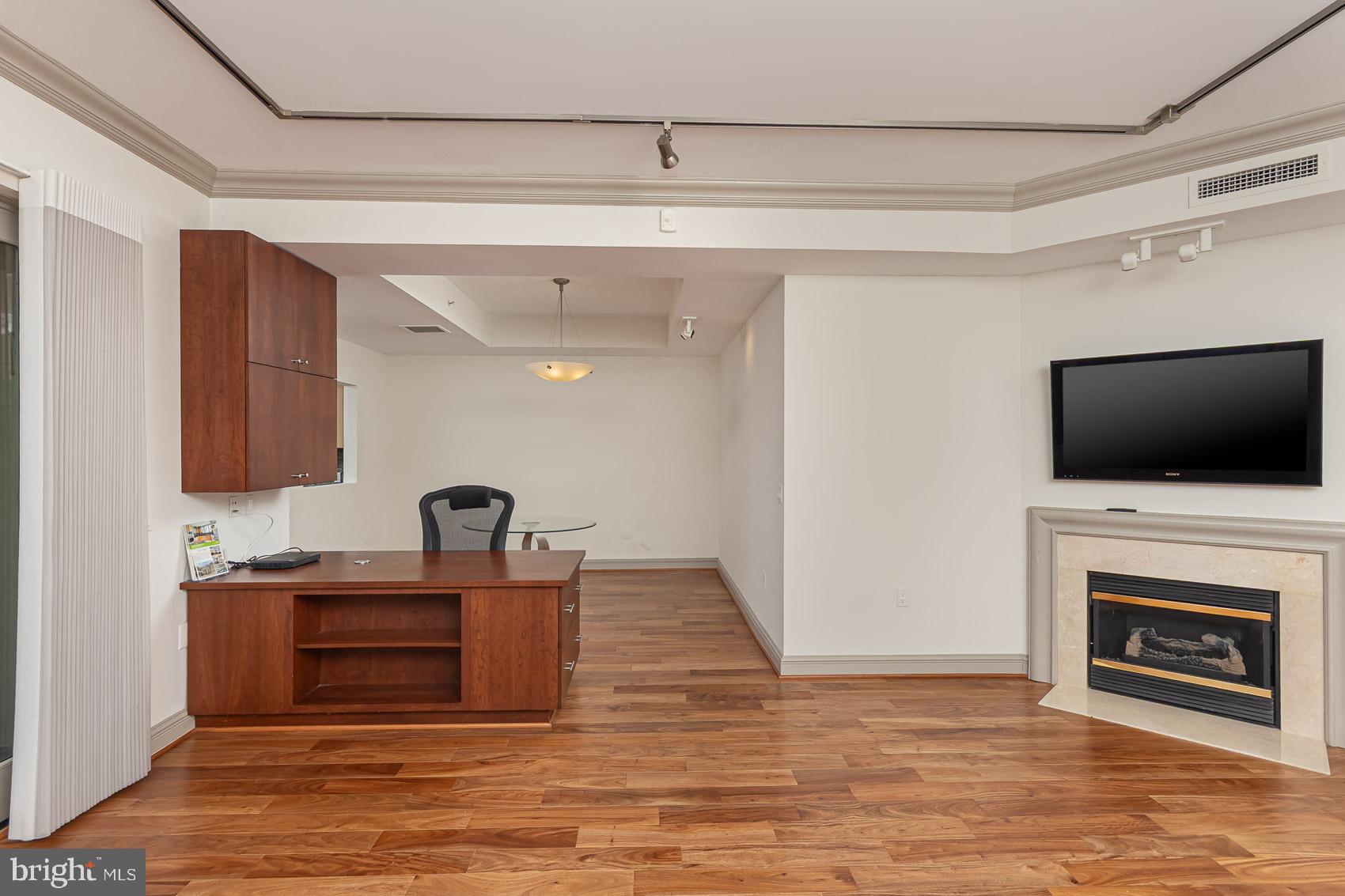 801 Key Highway, Unit 153 Baltimore, MD 21230 - Photo 12 of 40 a living room with furniture and a flat screen tv