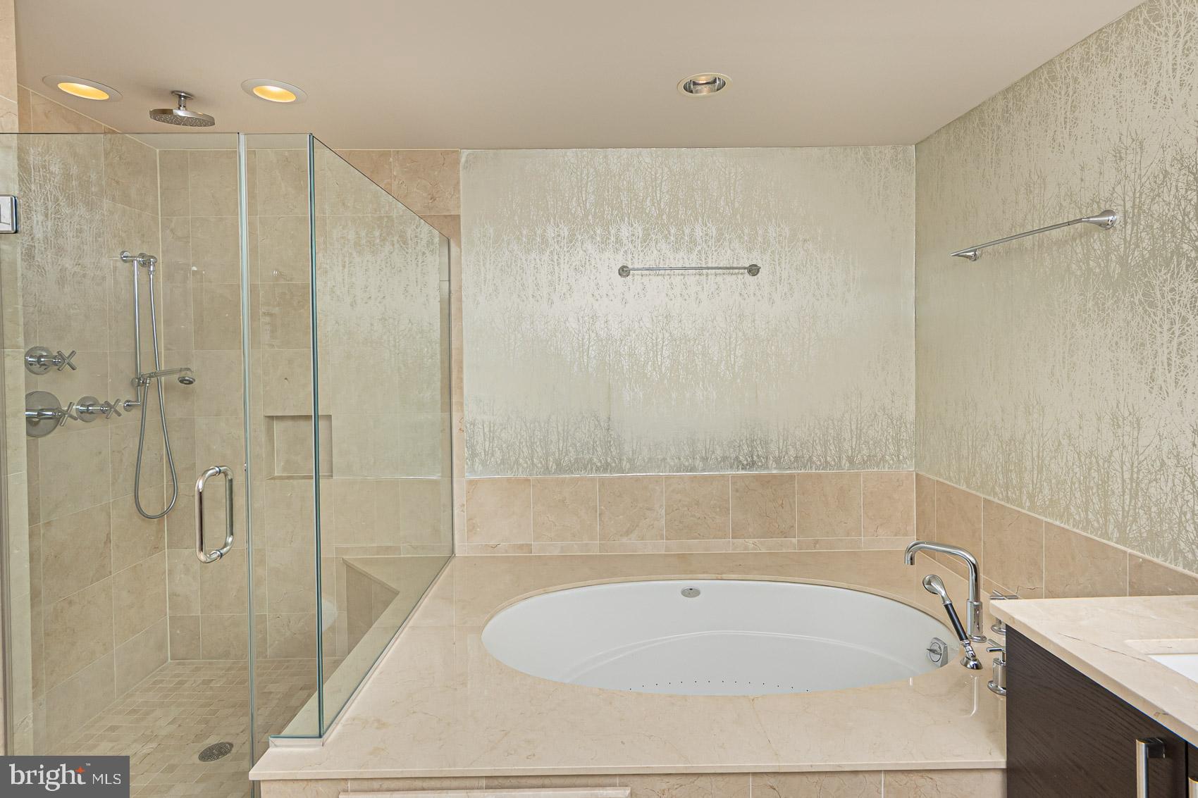 801 Key Highway, Unit 153 Baltimore, MD 21230 - Photo 25 of 40 a bathroom with a tub a toilet and a shower