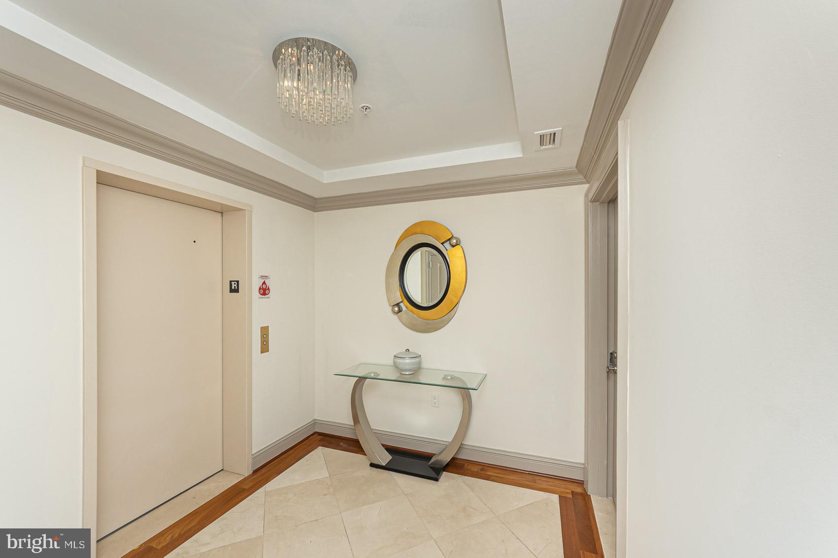 801 Key Highway, Unit 153 Baltimore, MD 21230 - Photo 31 of 40 a bathroom with a sink a mirror and a toilet