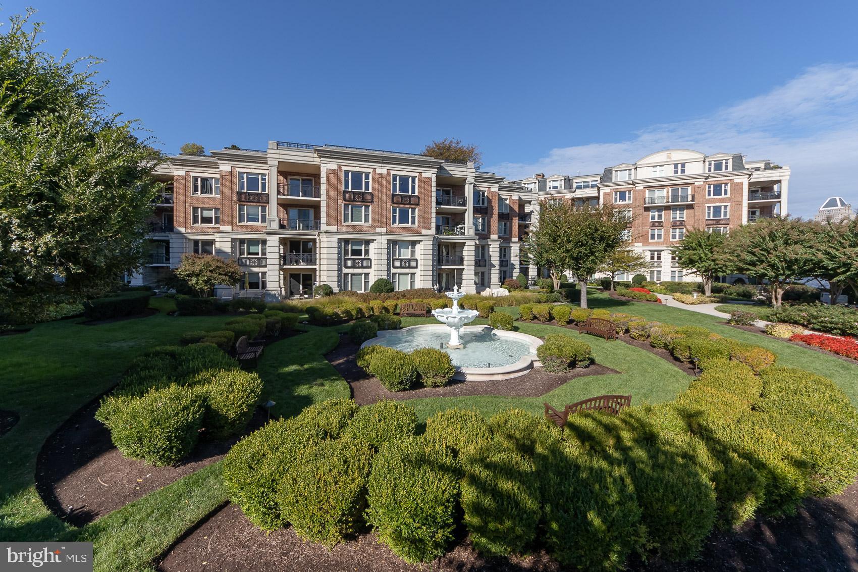 801 Key Highway, Unit 153 Baltimore, MD 21230 - Photo 35 of 40 a front view of a house with a garden and swimming pool