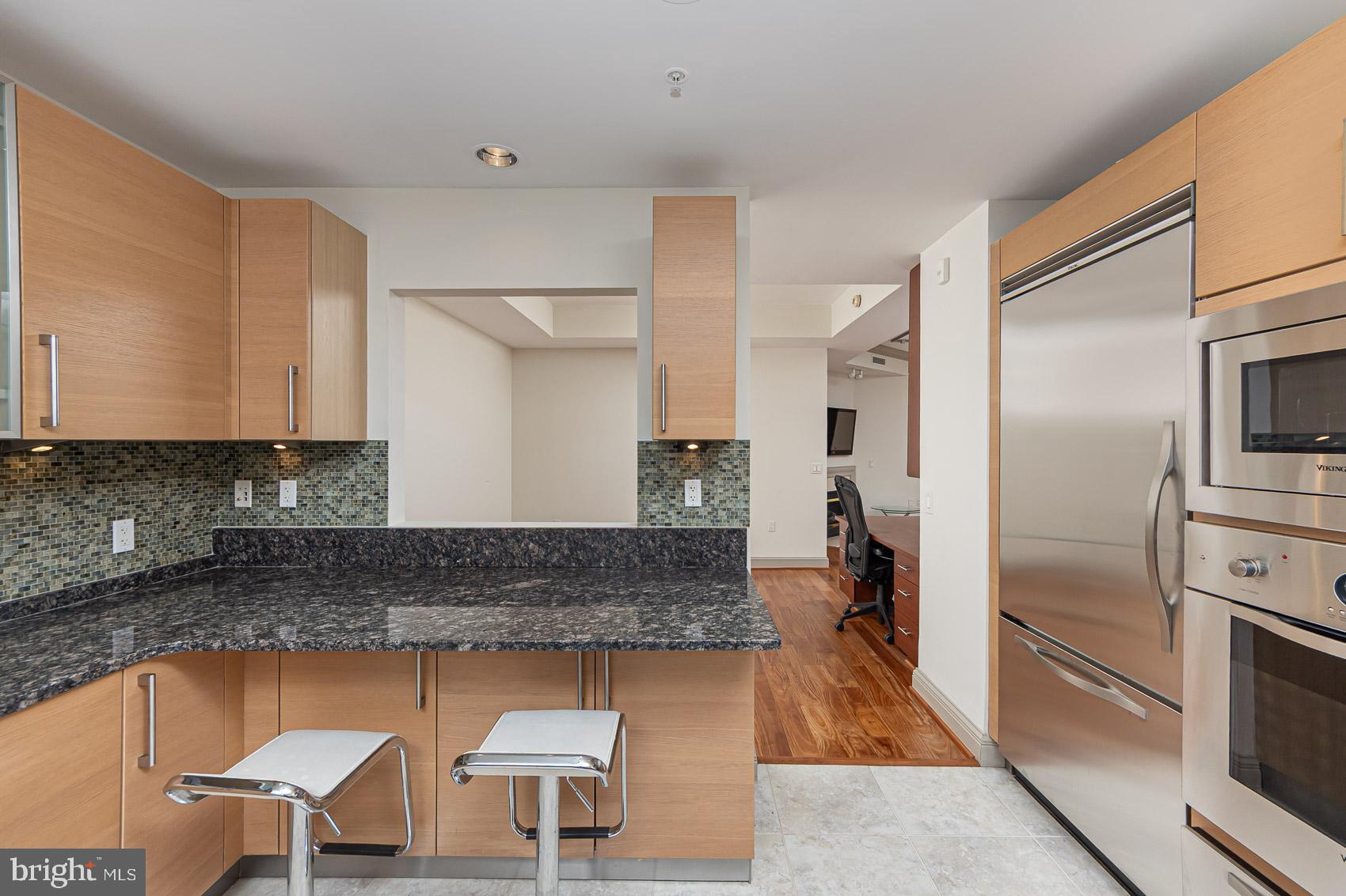 801 Key Highway, Unit 153 Baltimore, MD 21230 - Photo 6 of 40 a kitchen with a sink cabinets and stainless steel appliances