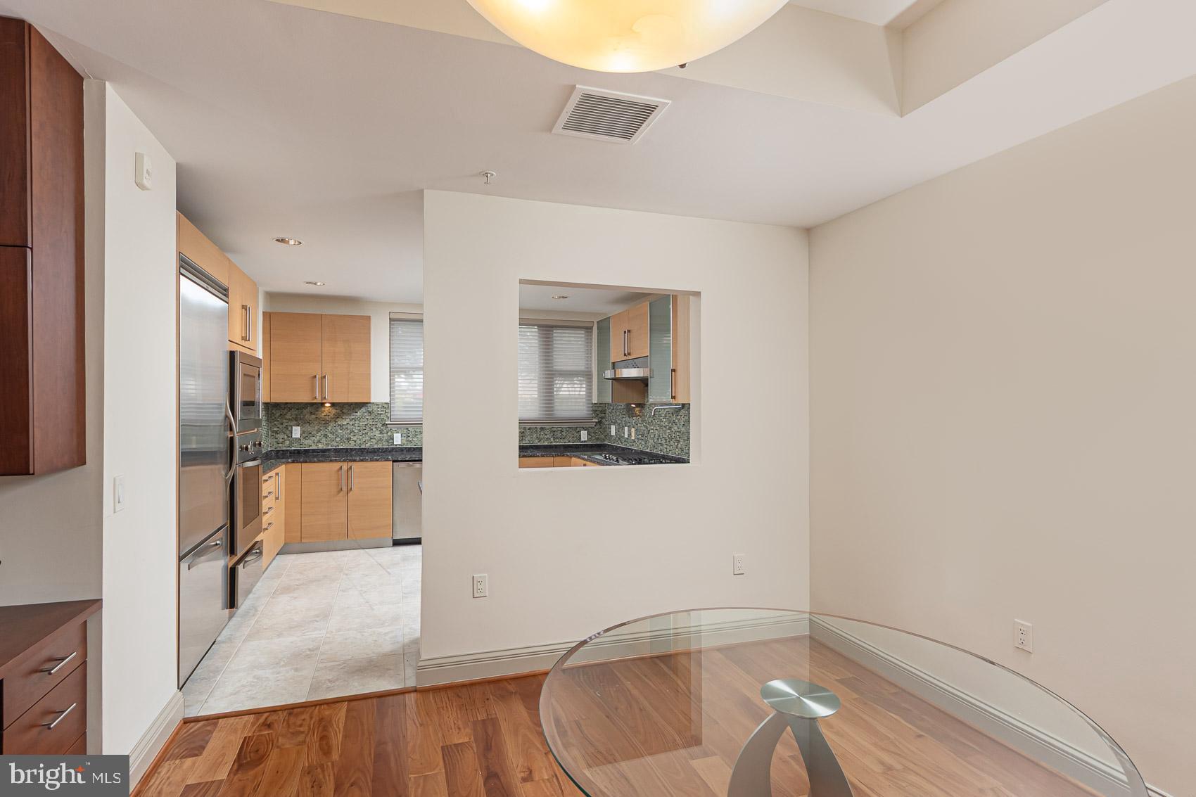 801 Key Highway, Unit 153 Baltimore, MD 21230 - Photo 8 of 40 a bathroom with a sink and a mirror