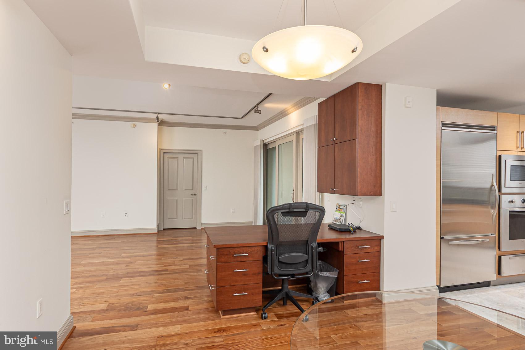 801 Key Highway, Unit 153 Baltimore, MD 21230 - Photo 10 of 40 a view of workspace with wooden floor windows