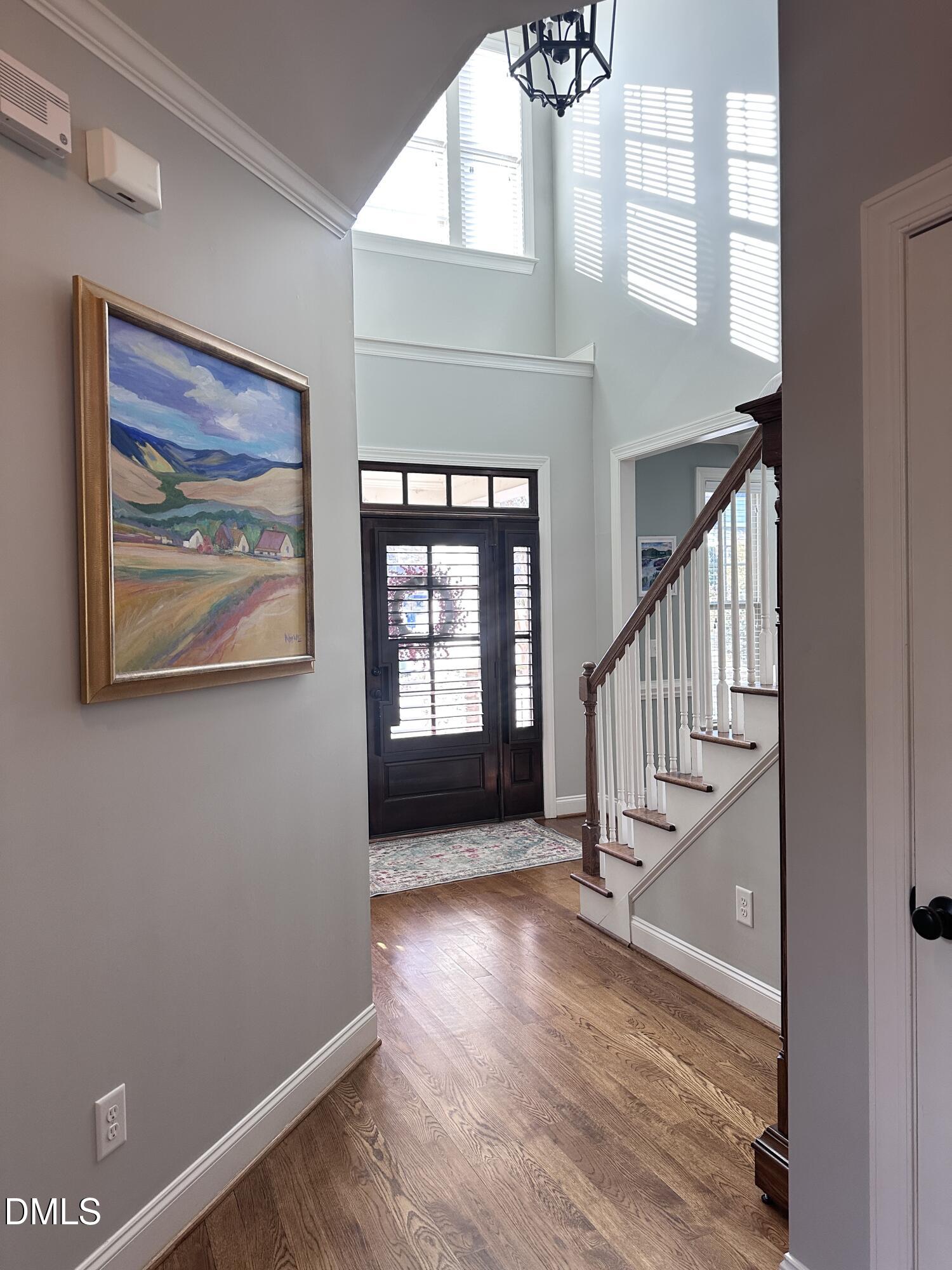 4603 Brighton Ridge Drive Apex, NC 27539 - Photo 11 of 69 a view of staircase with a rug and a window