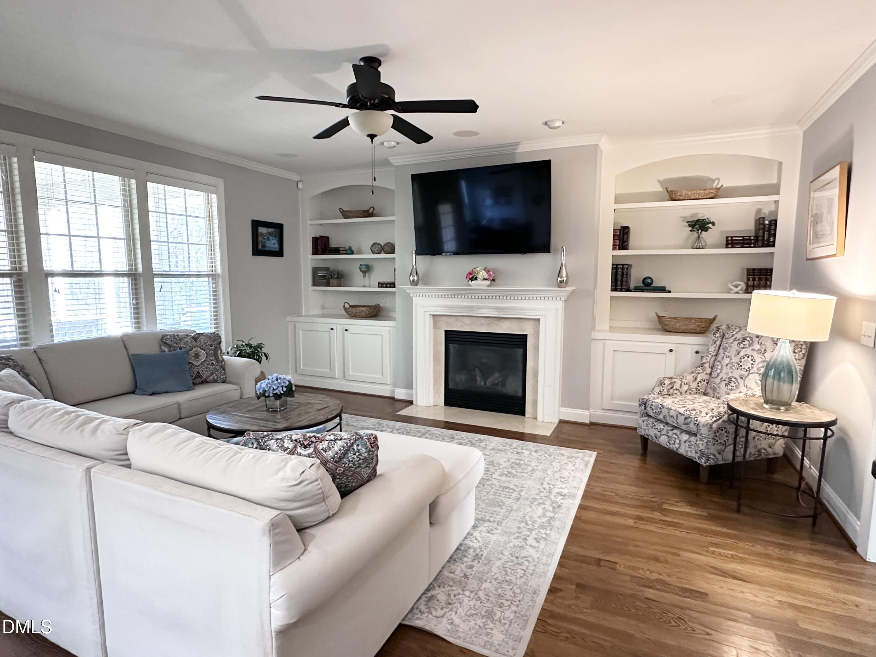 4603 Brighton Ridge Drive Apex, NC 27539 - Photo 13 of 69 a living room with furniture fireplace and flat screen tv