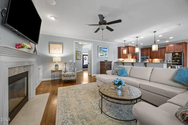 a kitchen with a stove sink and cabinets