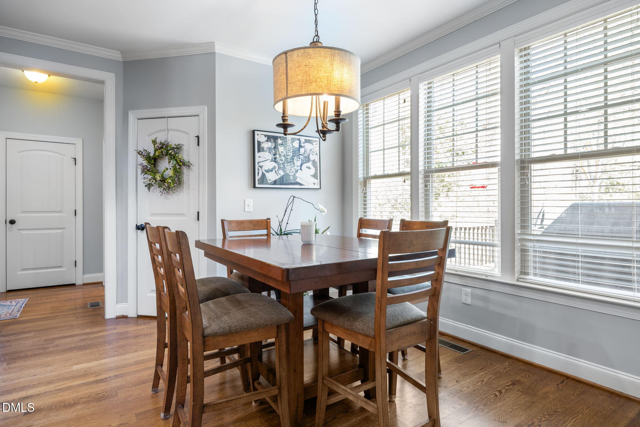 4603 Brighton Ridge Drive Apex, NC 27539 - Photo 22 of 69 a view of a dining room with furniture window and wooden floor