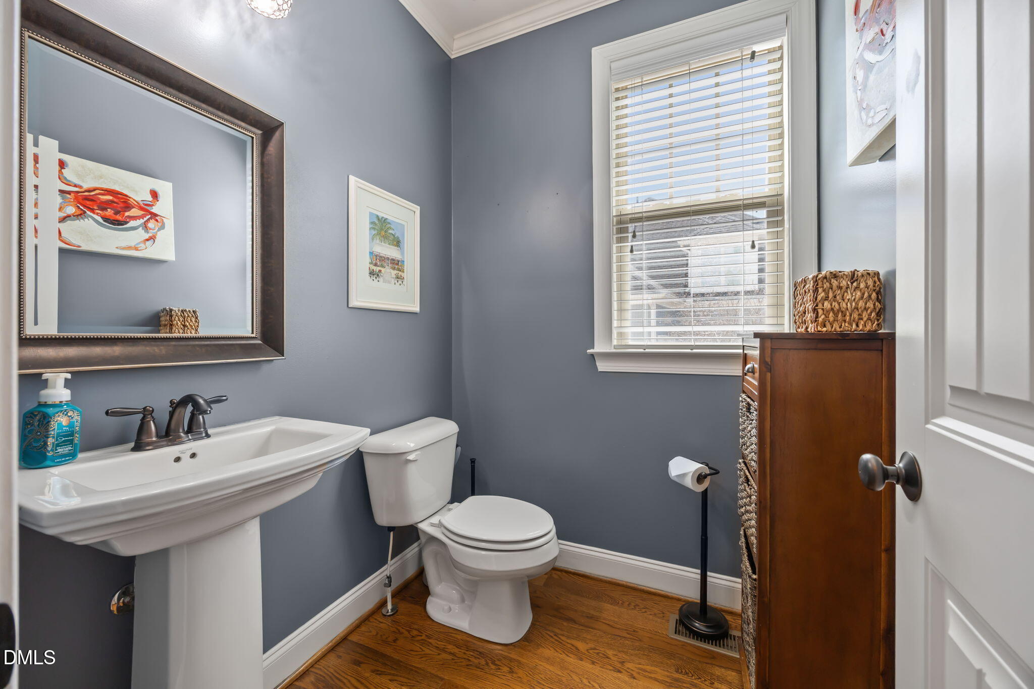 4603 Brighton Ridge Drive Apex, NC 27539 - Photo 23 of 69 a bathroom with a toilet sink and mirror