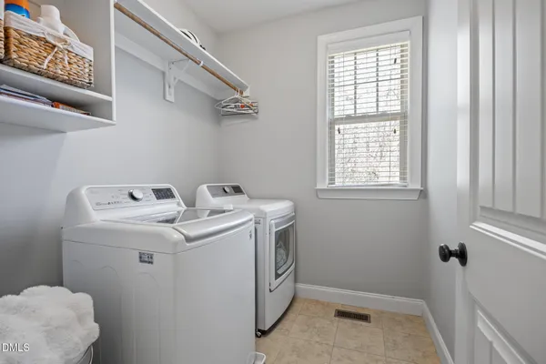 a bathroom with a granite countertop sink shower mirror and a