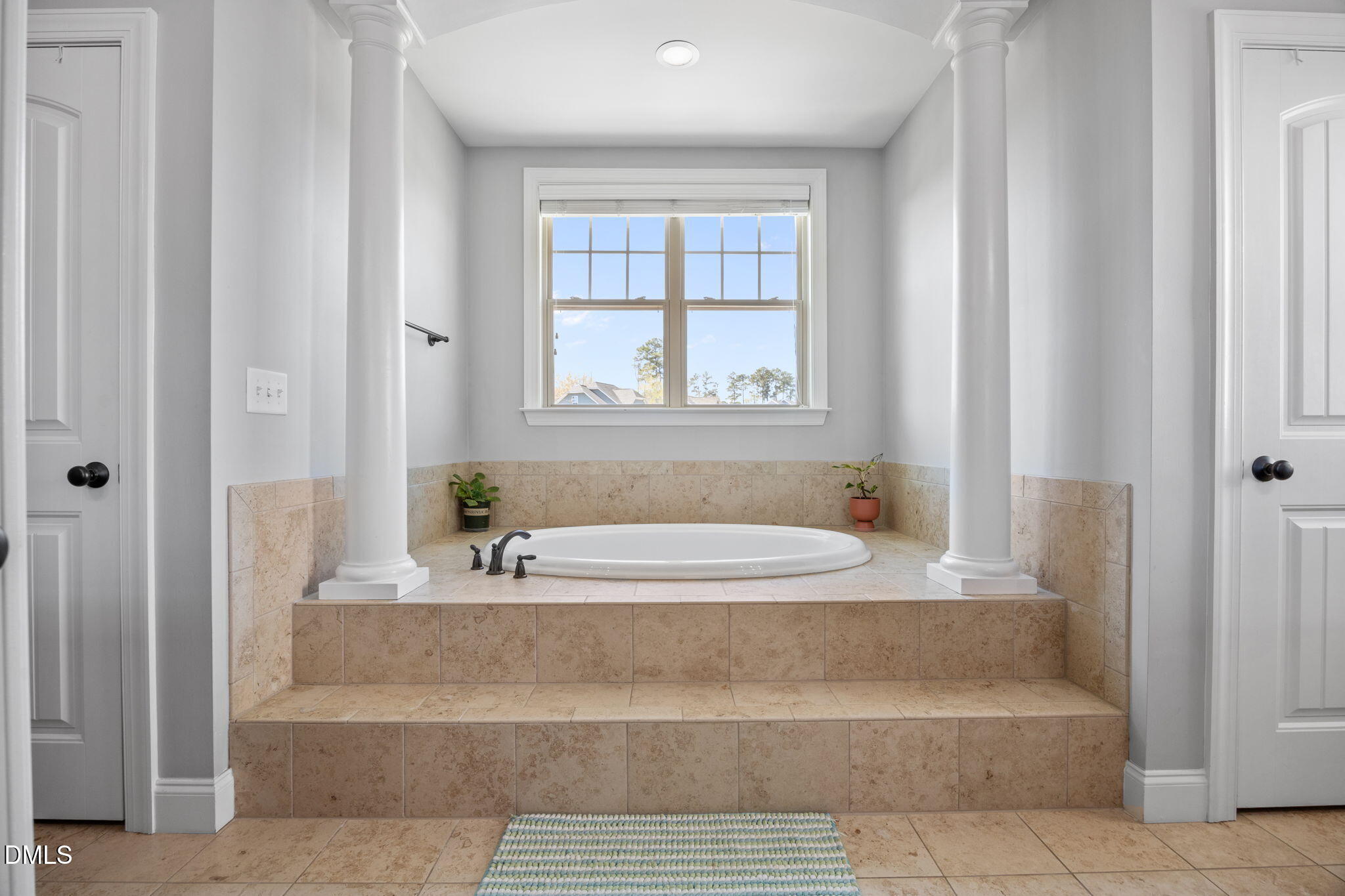 4603 Brighton Ridge Drive Apex, NC 27539 - Photo 27 of 69 a bathroom with a bathtub and shower