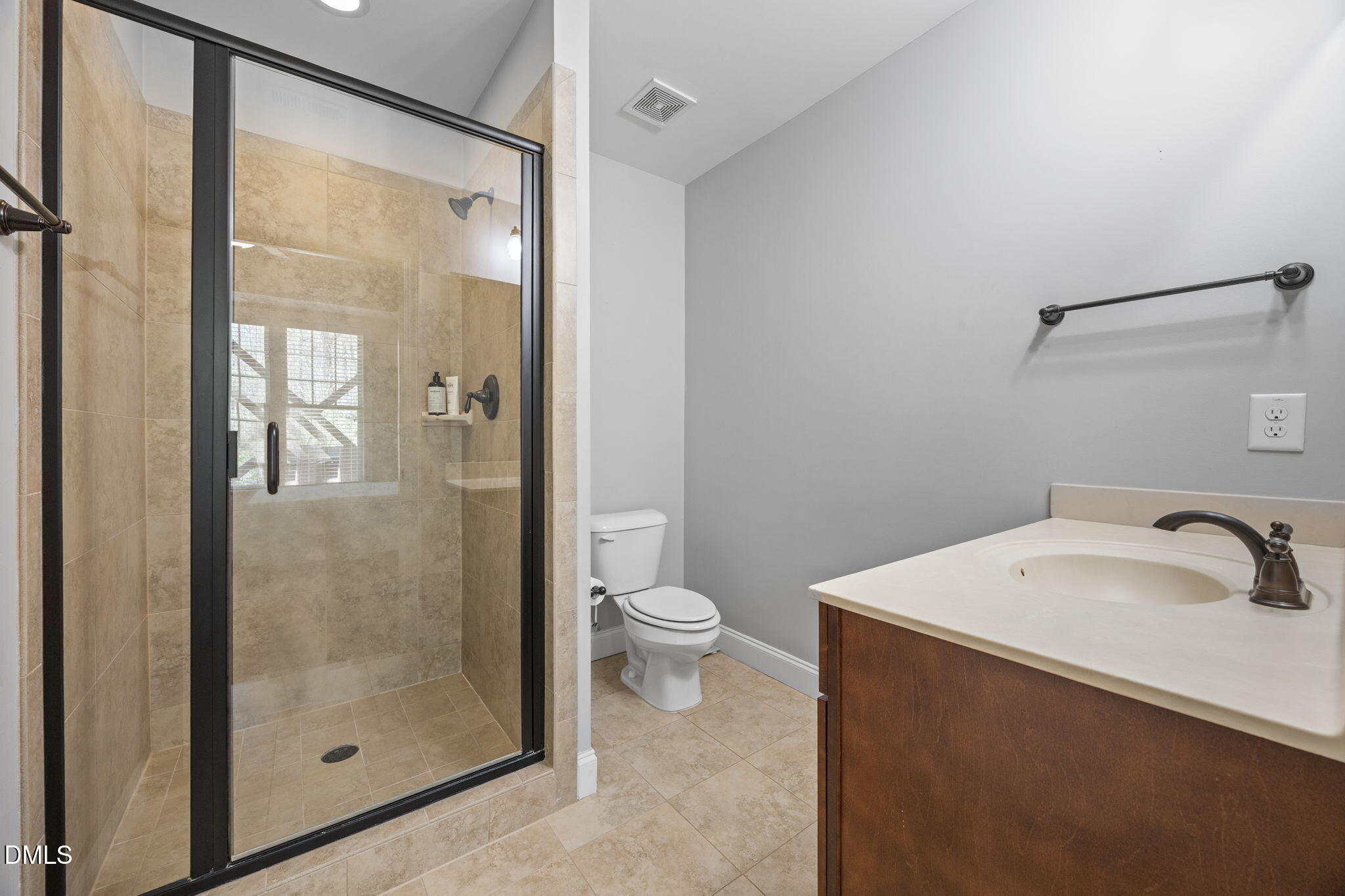 4603 Brighton Ridge Drive Apex, NC 27539 - Photo 45 of 69 a bathroom with a toilet a sink and shower