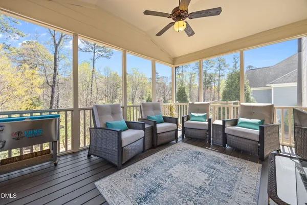 a view of a house with a yard and sitting area
