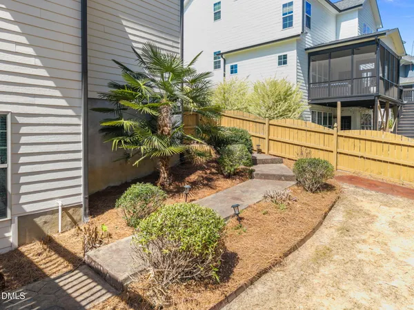 a view of a house with wooden deck front of house