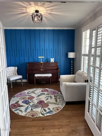 a view of staircase with a rug and a window