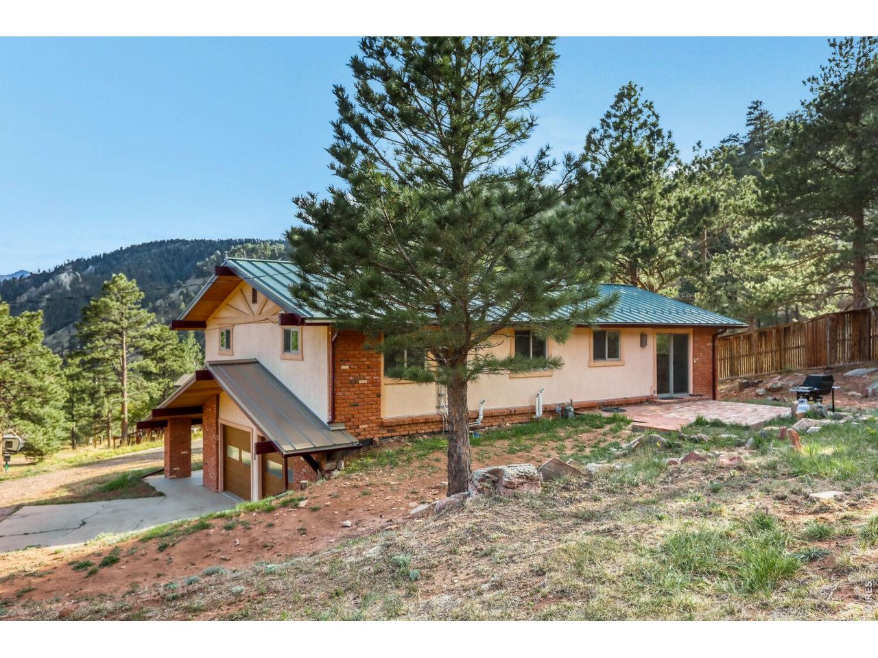 194 North Cedar Brook Road Boulder, CO 80304 - Photo 2 of 30 a view of a yard in front of a house with large tree