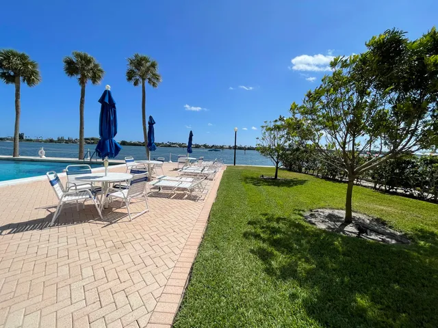 a view of a backyard with a garden and seating space