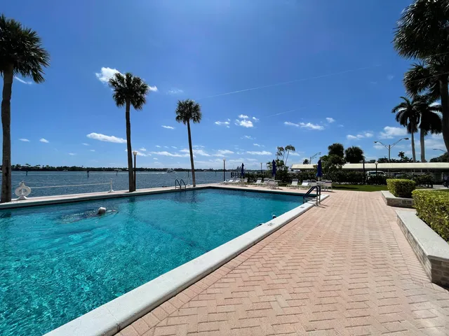 a view of swimming pool with a bench