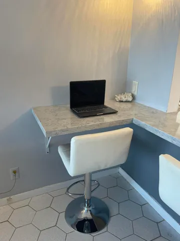 a living room with a couch and chairs