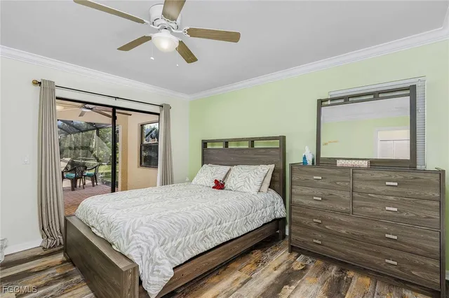 a bedroom with a bed and a large mirror