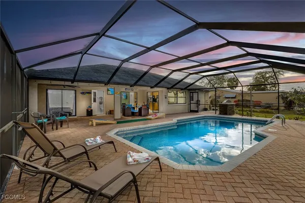 a view of a swimming pool with sitting area