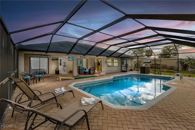 a view of a swimming pool with sitting area