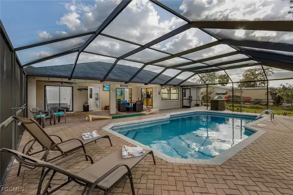 a view of a swimming pool with sitting area