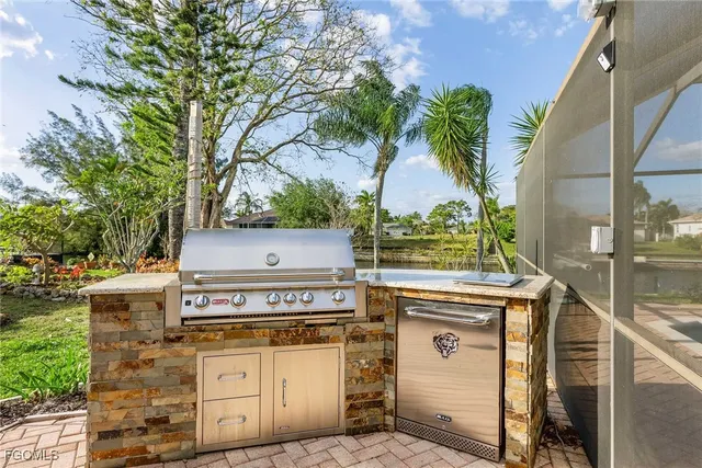 a living room with furniture and a ceiling fan