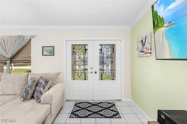 a view of a lake with a big yard and a large mountain view