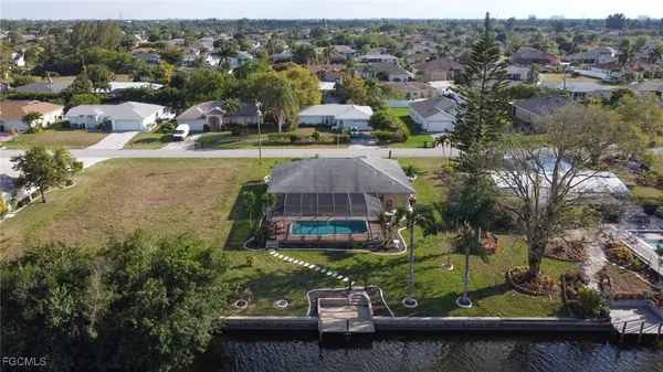 an aerial view of a house with a lake view