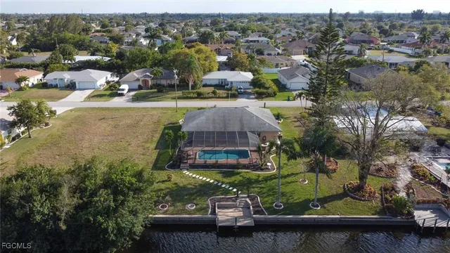 an aerial view of a house with a lake view