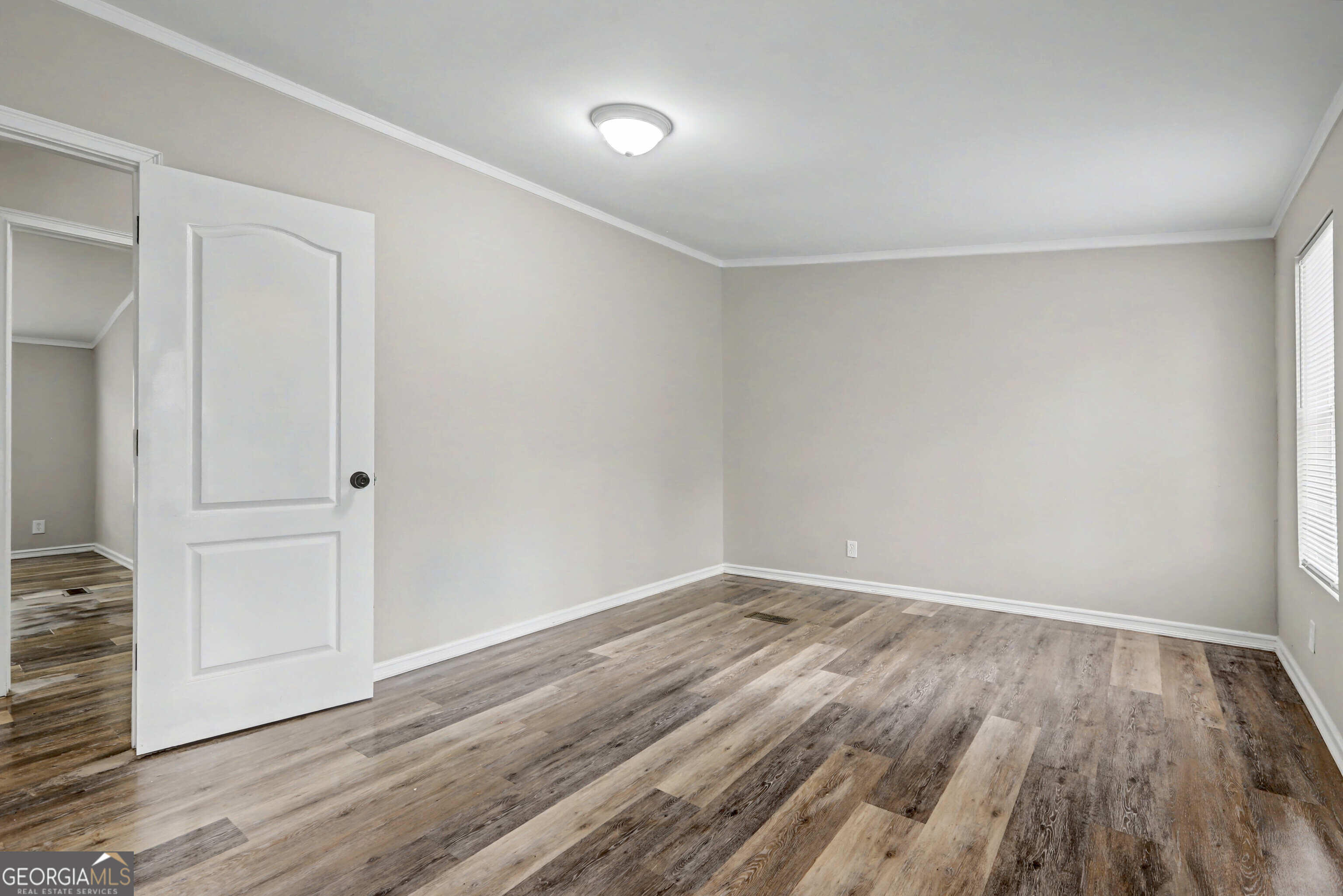 194 McKneely Road Milner, GA 30257 - Photo 16 of 30 a view of room with wooden floor