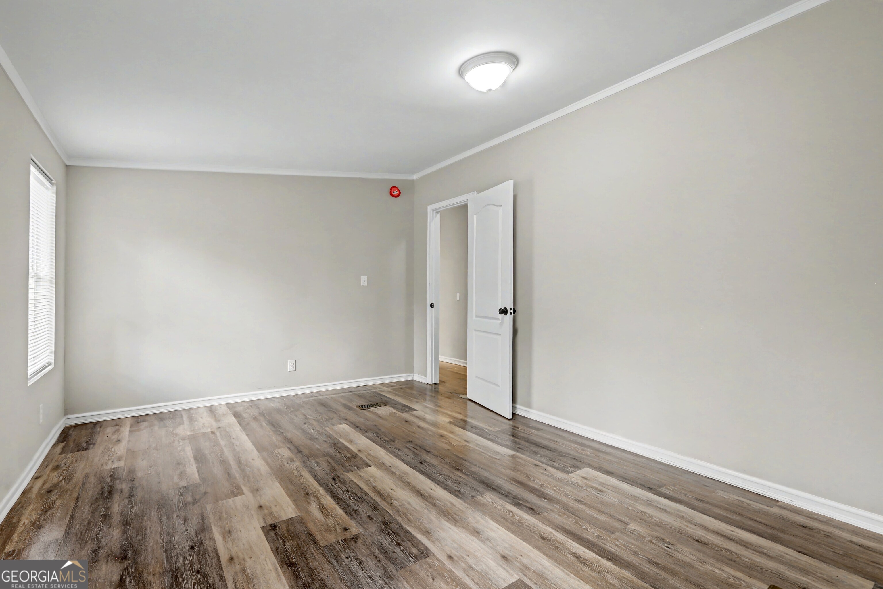 194 McKneely Road Milner, GA 30257 - Photo 17 of 30 a view of room with wooden floor