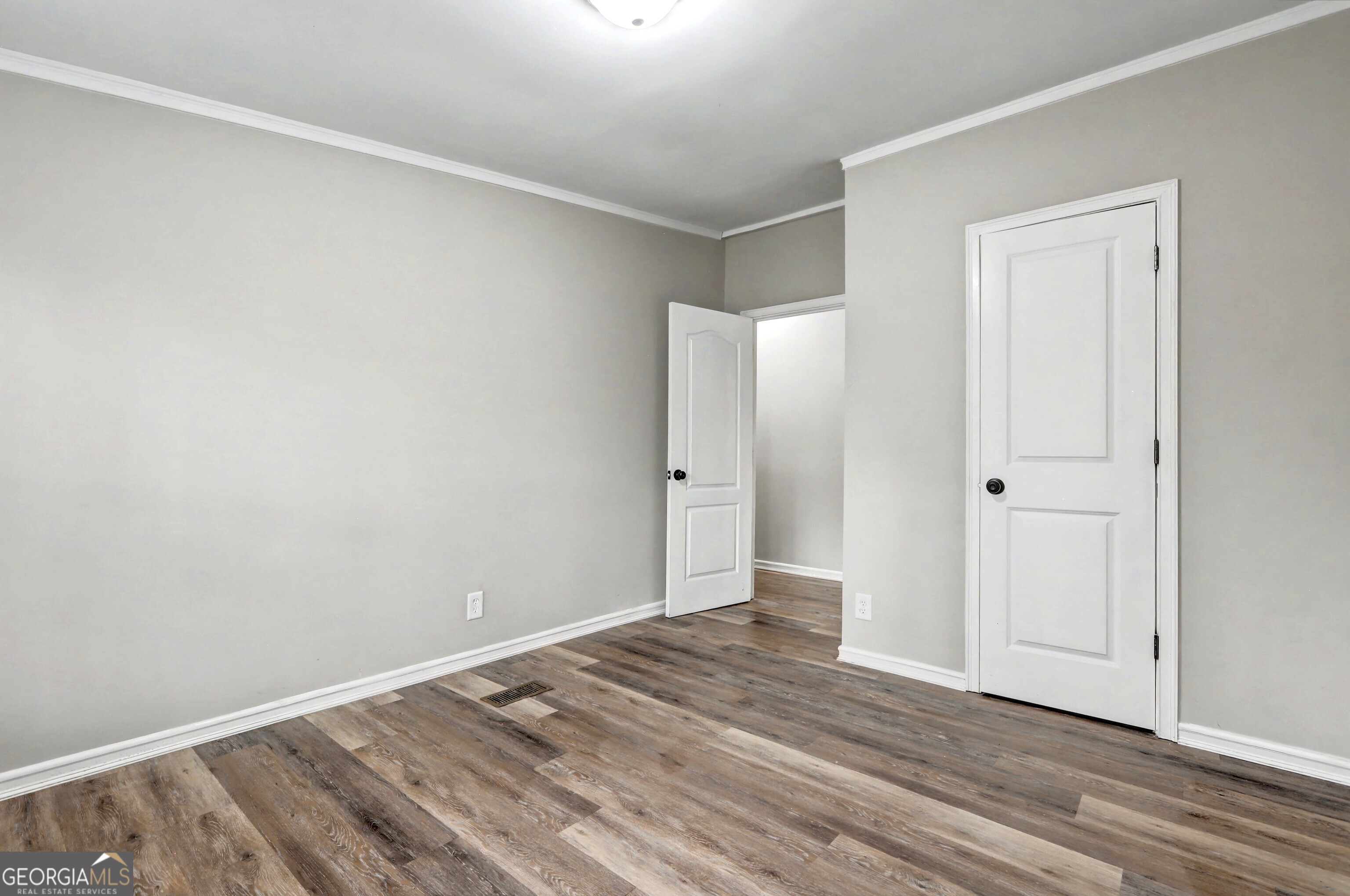 194 McKneely Road Milner, GA 30257 - Photo 19 of 30 a view of a room with wooden floor and closet