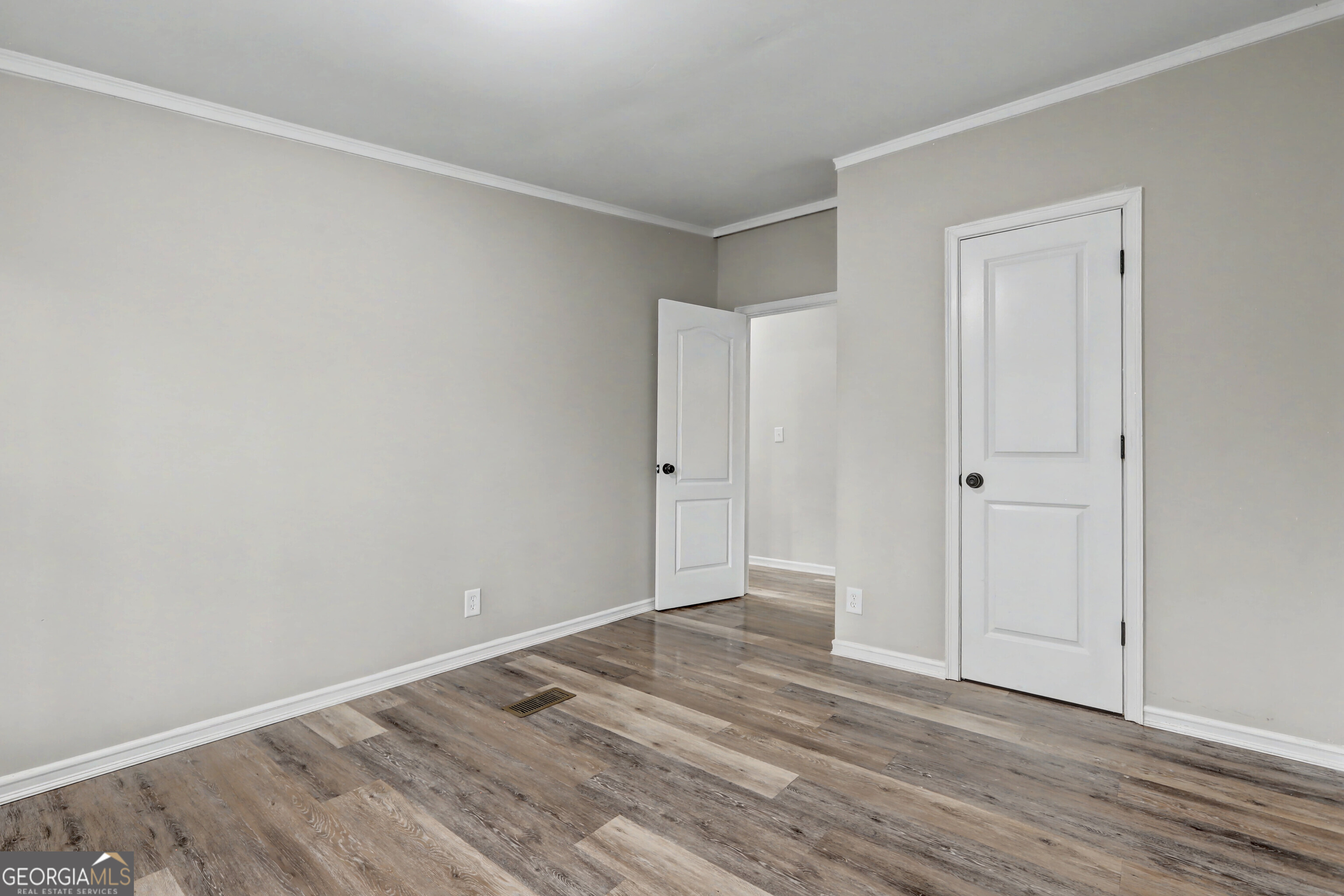 194 McKneely Road Milner, GA 30257 - Photo 21 of 30 a view of an empty room with wooden floor