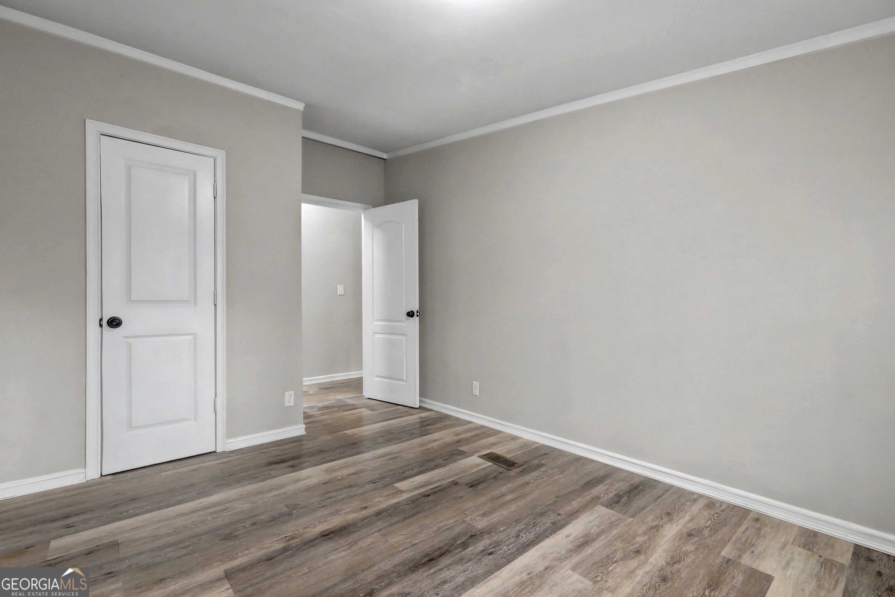 194 McKneely Road Milner, GA 30257 - Photo 23 of 30 a view of an empty room with wooden floor and closet