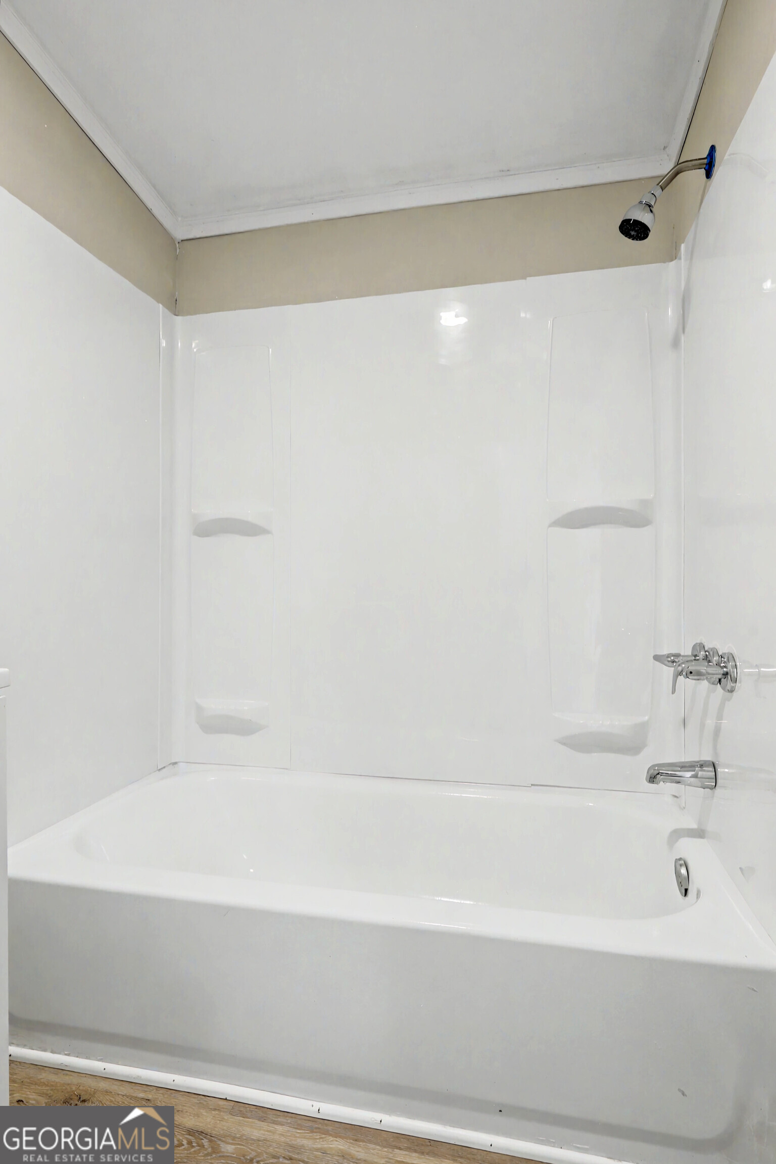 194 McKneely Road Milner, GA 30257 - Photo 25 of 30 a bathroom with a bathtub and a shower