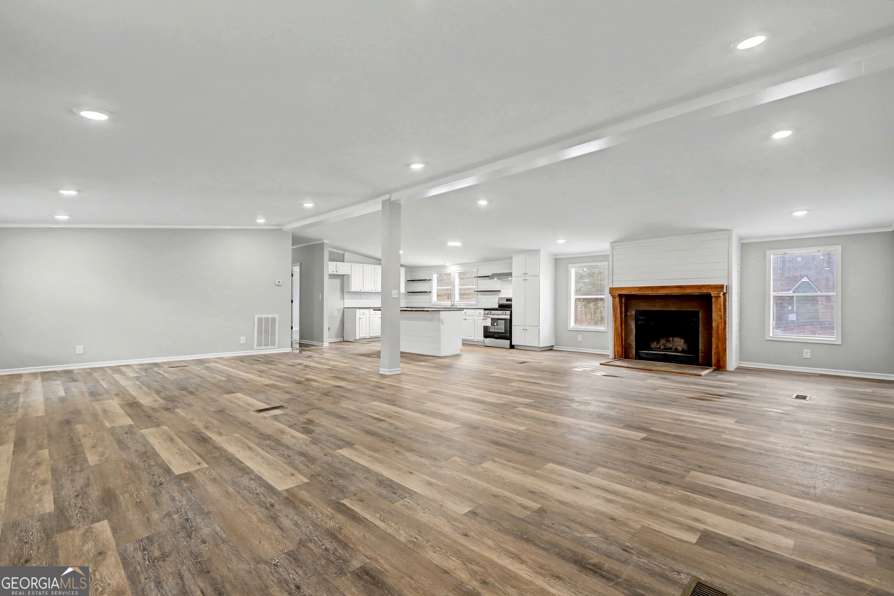 194 McKneely Road Milner, GA 30257 - Photo 28 of 30 a view of an empty room with a fireplace and a window