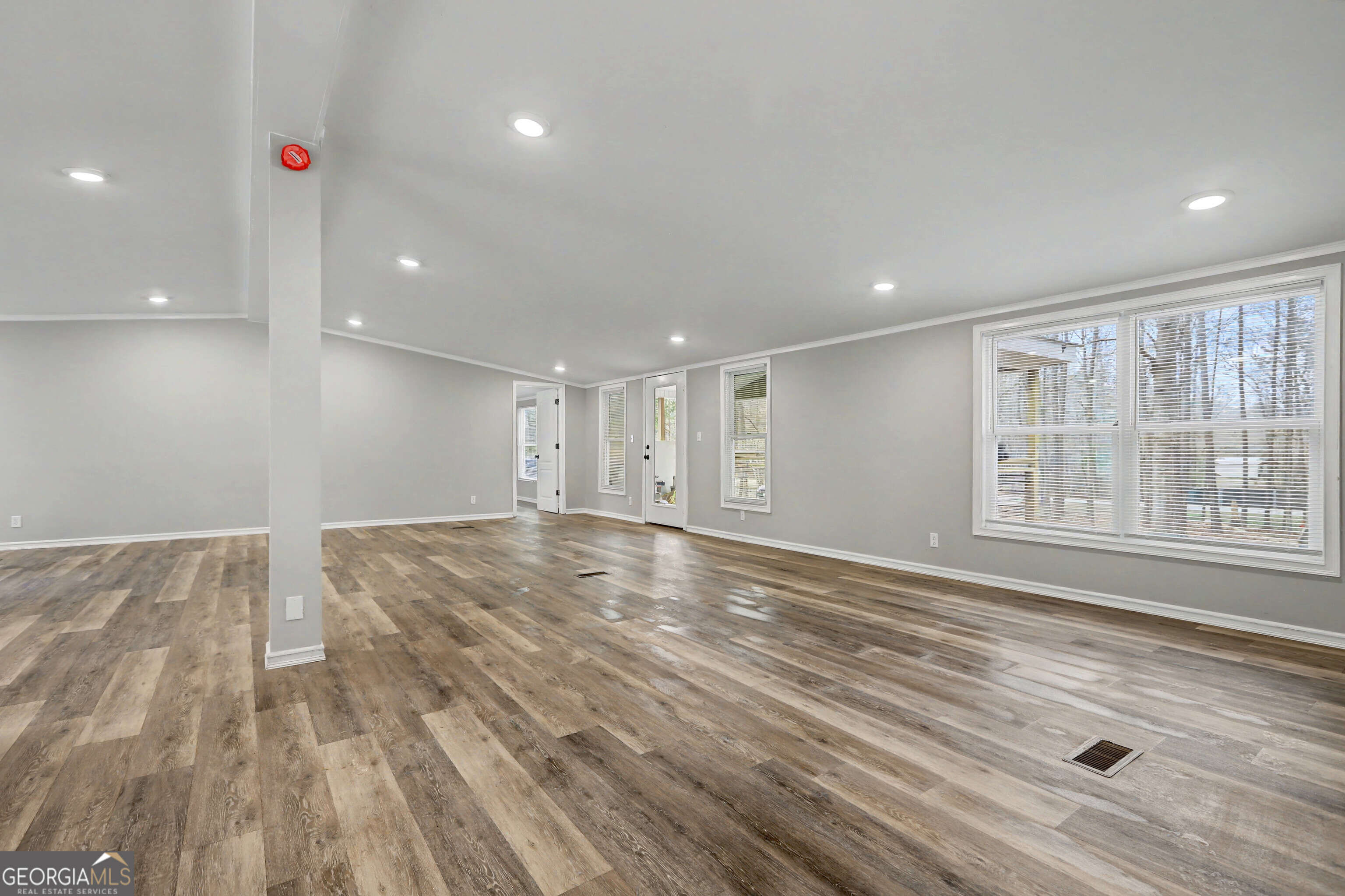194 McKneely Road Milner, GA 30257 - Photo 30 of 30 a view of an empty room with wooden floor and a window