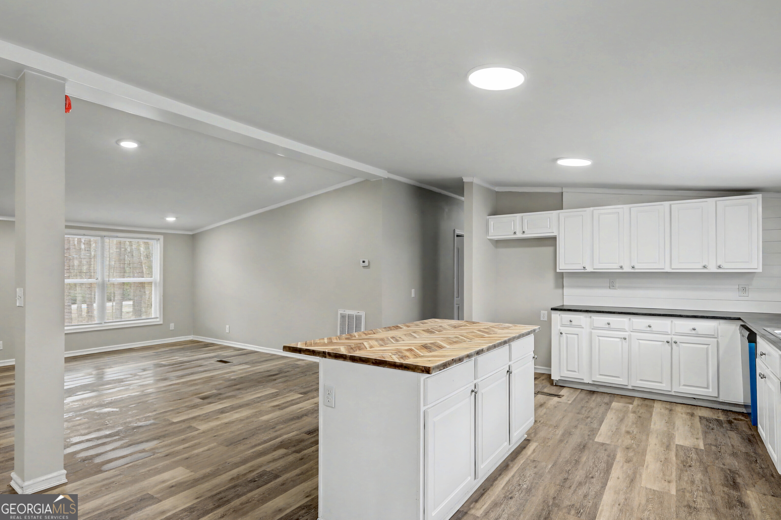 194 McKneely Road Milner, GA 30257 - Photo 7 of 30 a kitchen with a sink stove and cabinets