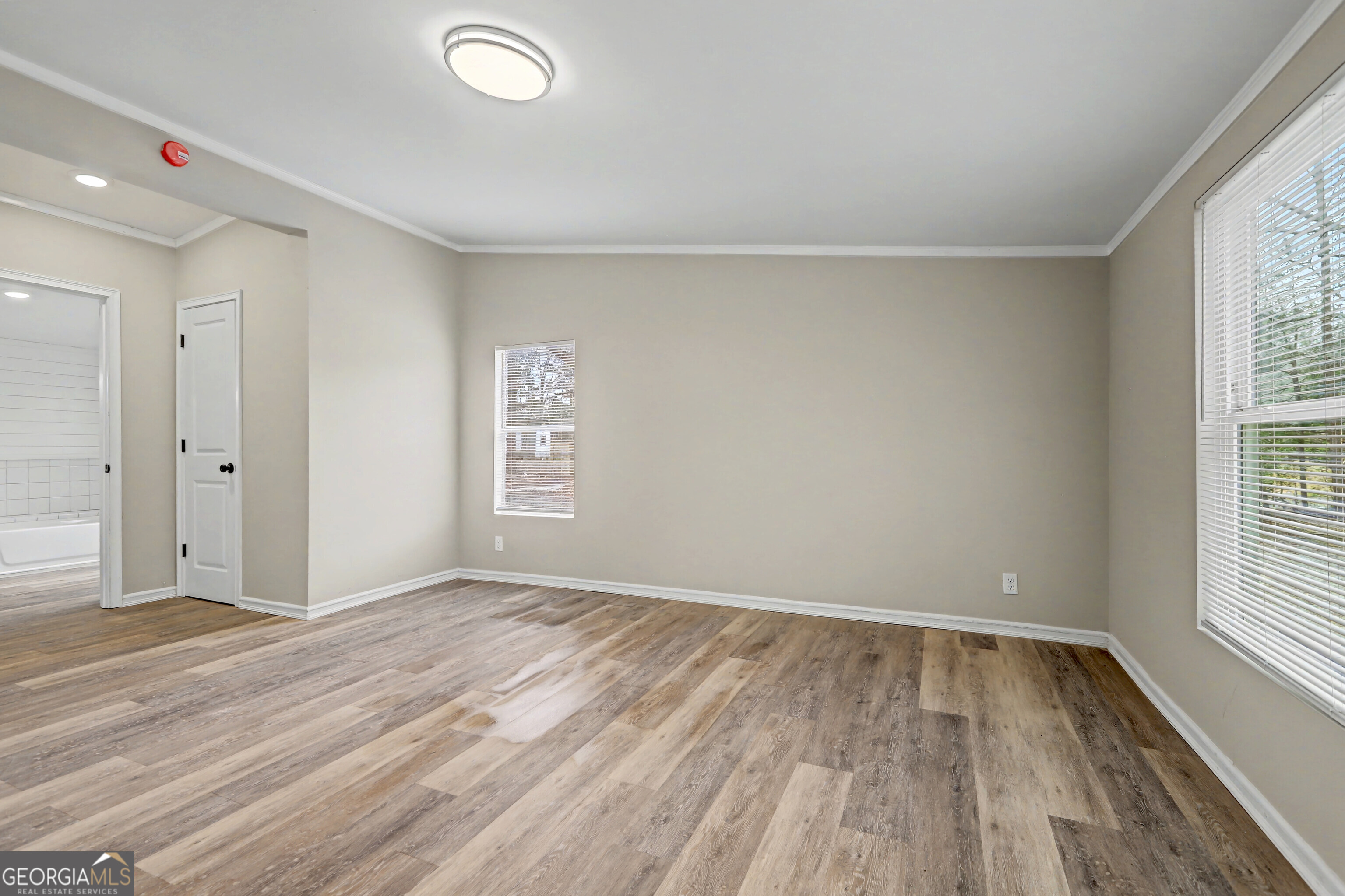 194 McKneely Road Milner, GA 30257 - Photo 9 of 30 wooden floor in an empty room with a window