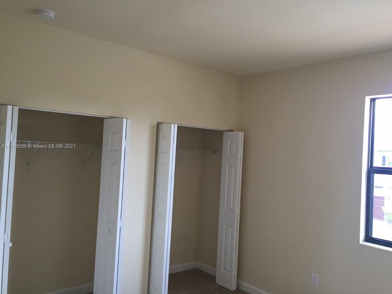 8630 West 33rd Avenue Hialeah, FL 33018 - Photo 17 of 22 a view of hallway with window