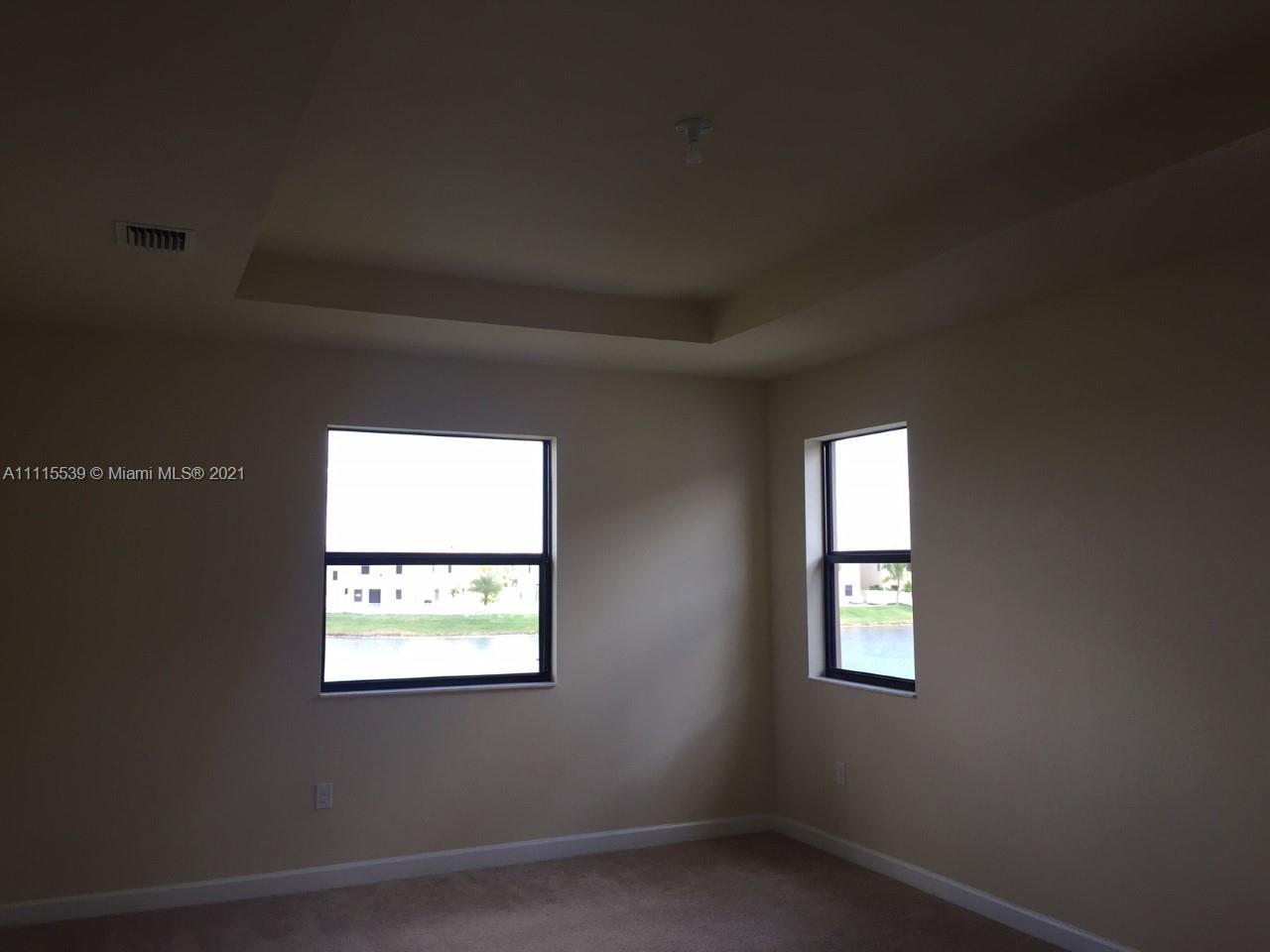 8630 West 33rd Avenue Hialeah, FL 33018 - Photo 18 of 22 an empty room with a window