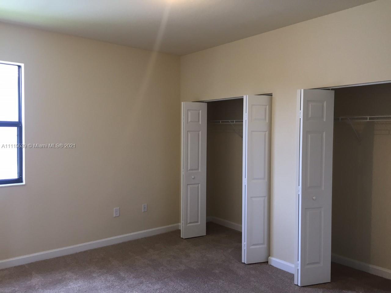 8630 West 33rd Avenue Hialeah, FL 33018 - Photo 7 of 22 an empty room with windows