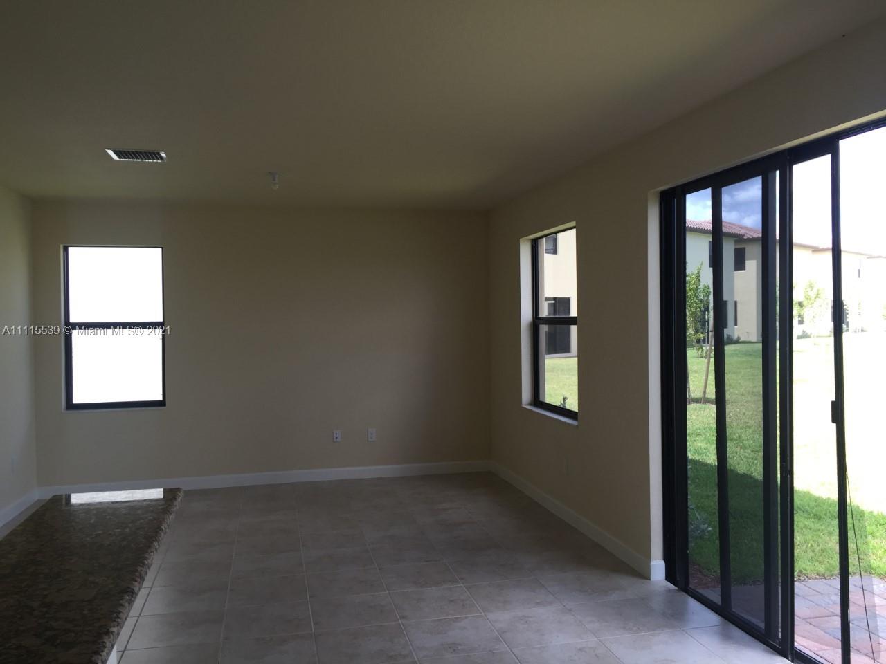 8630 West 33rd Avenue Hialeah, FL 33018 - Photo 8 of 22 a view of an empty room and window
