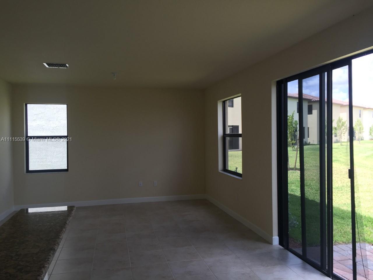 8630 West 33rd Avenue Hialeah, FL 33018 - Photo 9 of 22 a view of an empty room and window