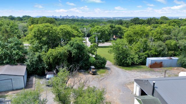 a view of a garden with a building